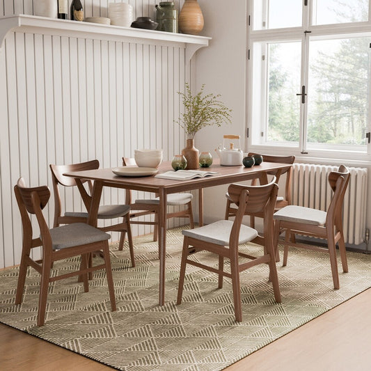 Dining room with wooden table and chairs on a patterned rug