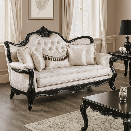 Decorative sofa with ornate black frame and white cushions in a living room setting.