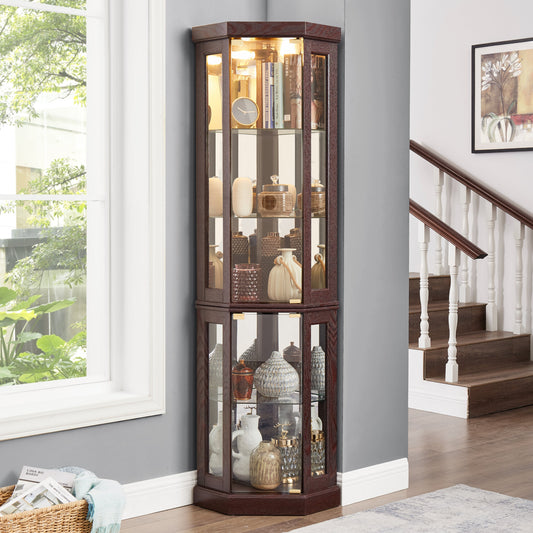 Corner display cabinet with glass doors in a room with a window and staircase.
