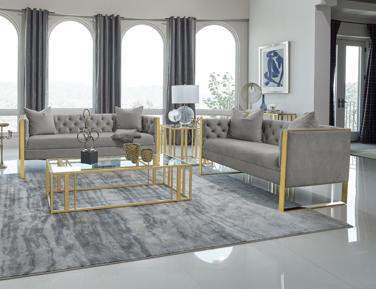 Modern living room with gray sofa, coffee table, and decorative elements.