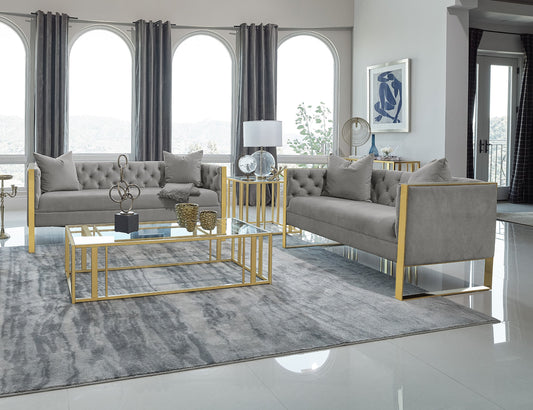 Modern living room with gray sofa, coffee table, and decorative elements.