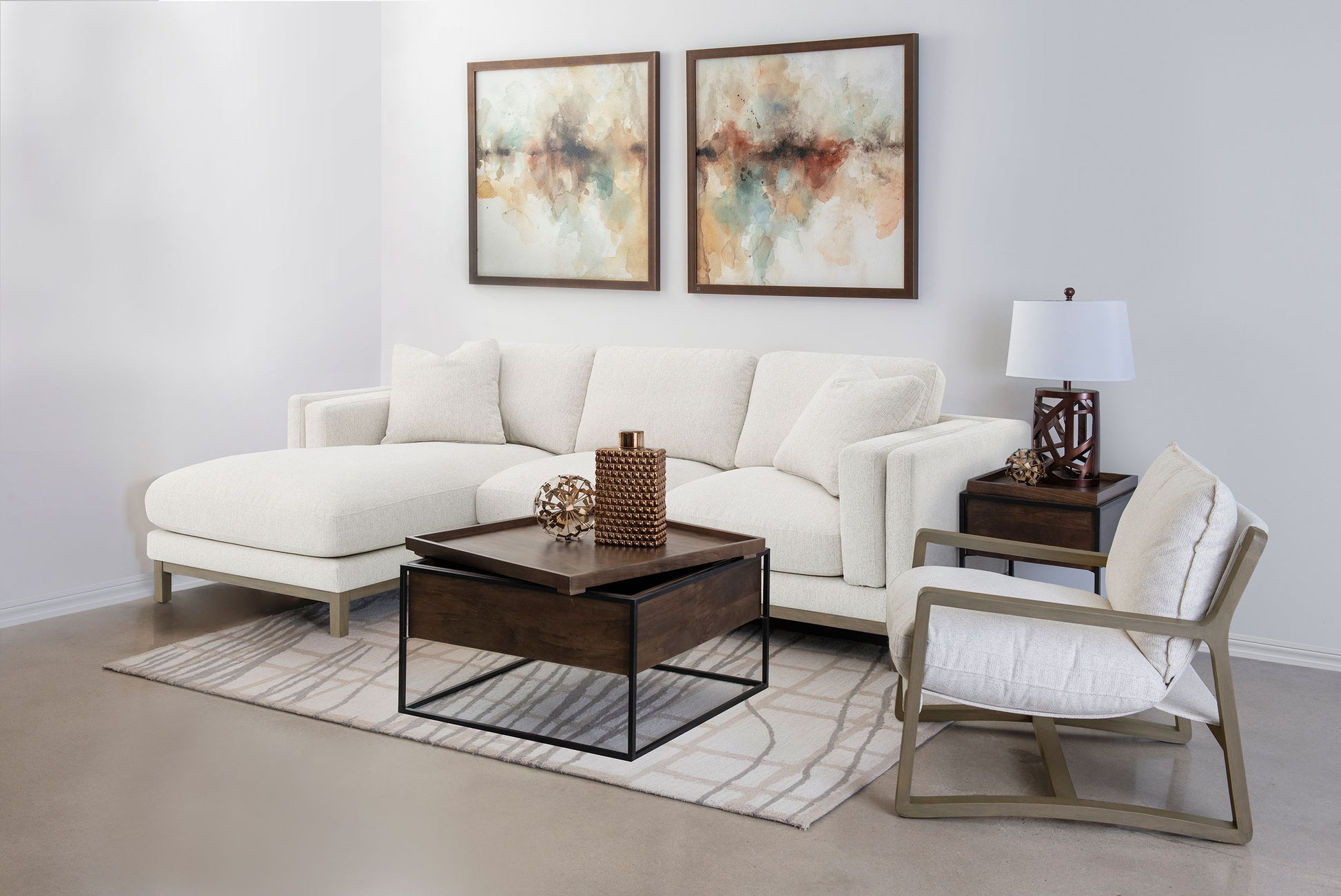 Modern living room with a white sectional sofa, coffee table, and side chair.