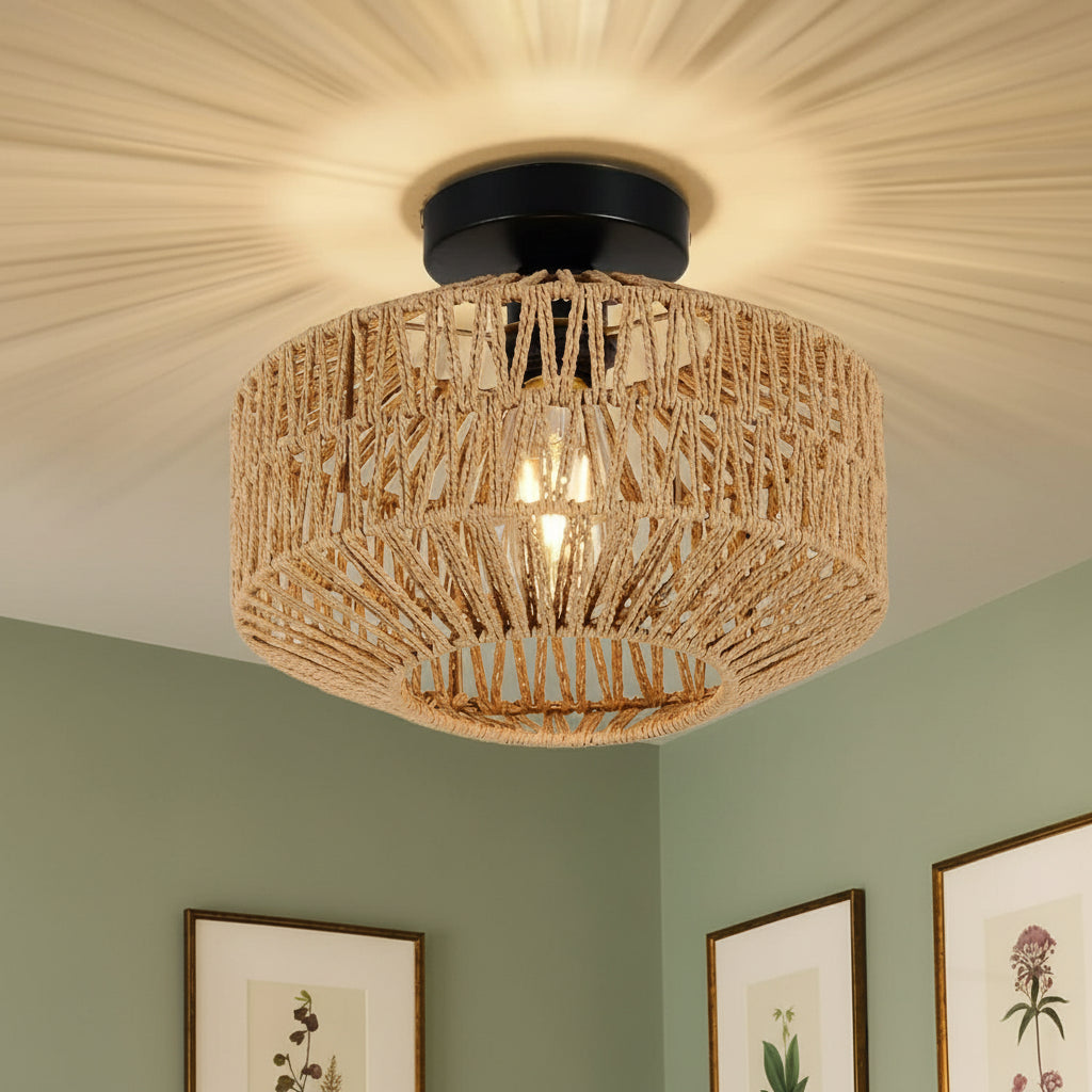 Woven ceiling light fixture in a room with framed pictures on the wall.