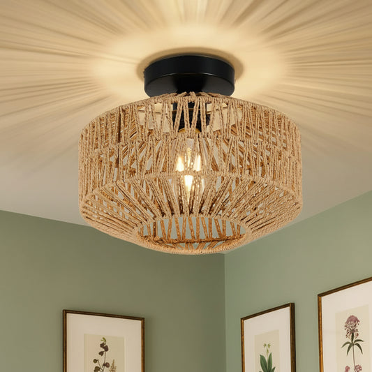 Woven ceiling light fixture in a room with framed pictures on the wall.