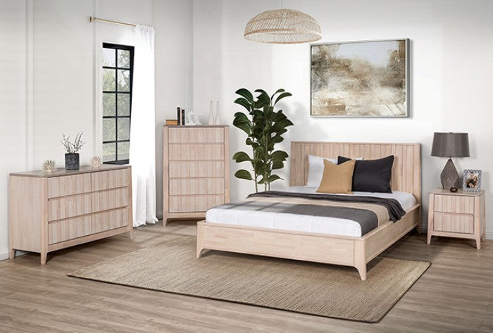 Beige bedroom furniture set with bed, dresser, and nightstands in a room with plants and decor.