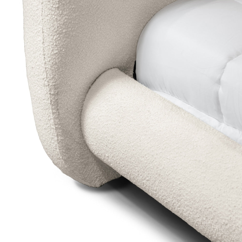 Close-up of a beige textured armchair with a white cushion on a white background