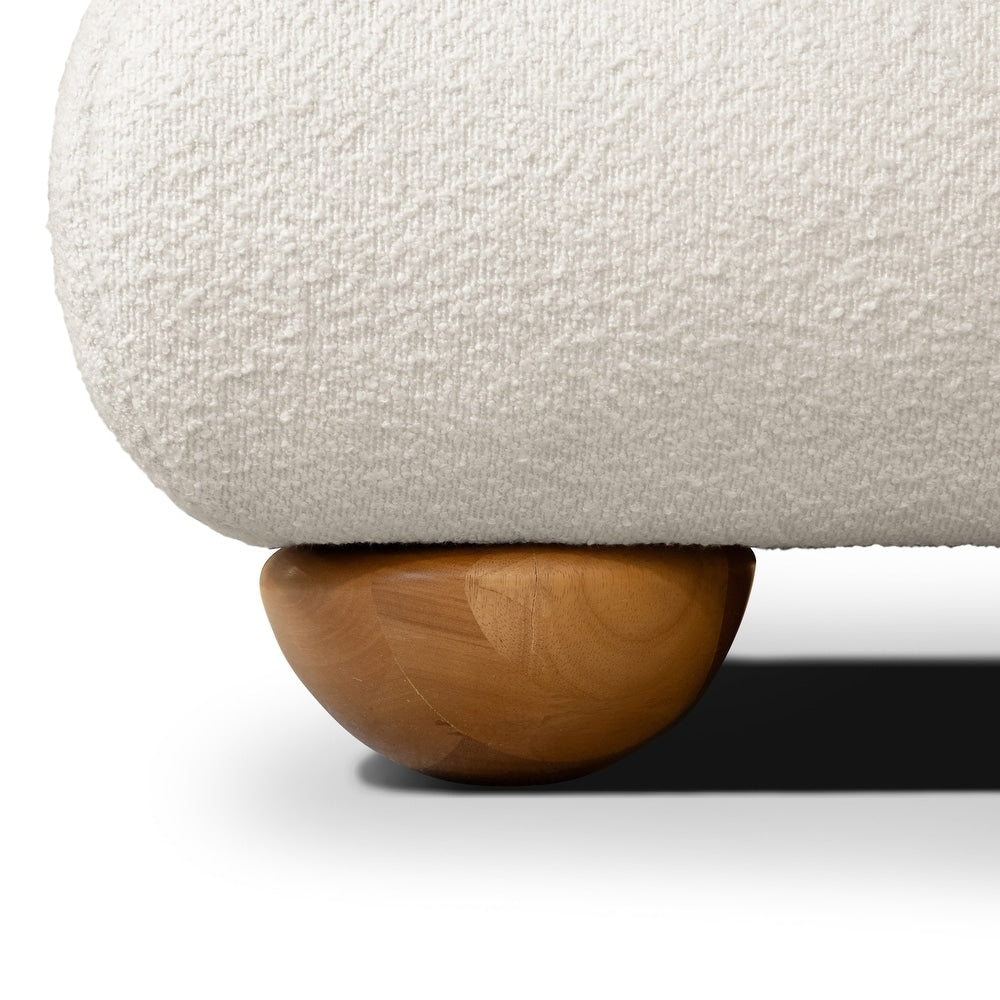 Close-up of a textured white surface with a wooden ball at the bottom.