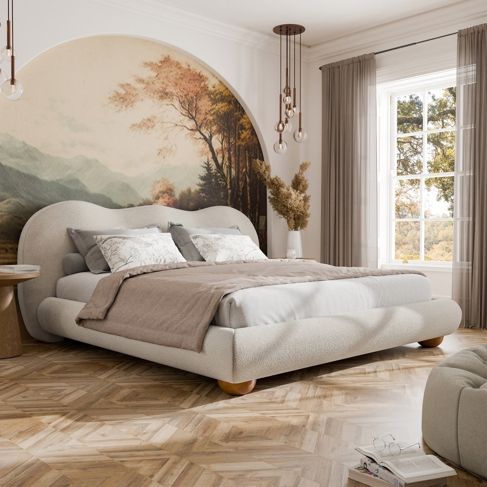 Modern bedroom with a large bed, decorative wall art, and natural light.