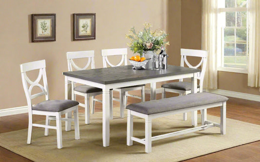 Dining room set with table, chairs, and bench in a home setting.