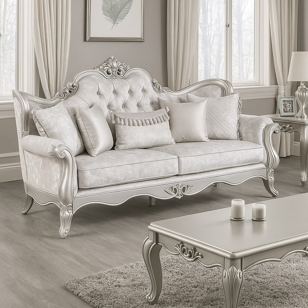 Decorative silver sofa in a stylish living room with a coffee table and framed picture.