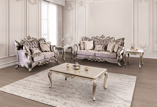Luxurious living room with ornate silver and white furniture.