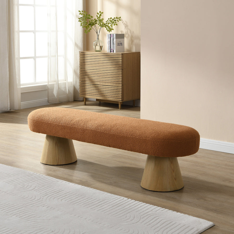 Brown bench with wooden legs in a room with a cabinet and window