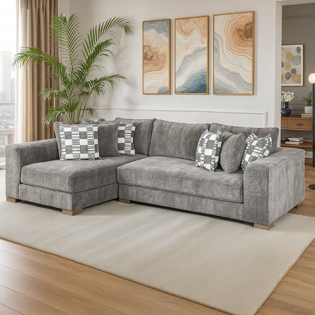 Gray sectional sofa with patterned cushions in a living room setting.
