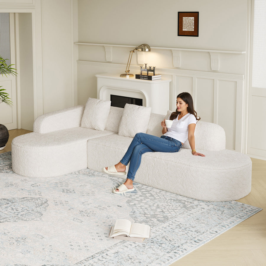 111.8-inch L-shaped curved modular sofa, modern design featuring lychee-textured long-pile polyester fabric, curved backrest with three pillows - primary color shot