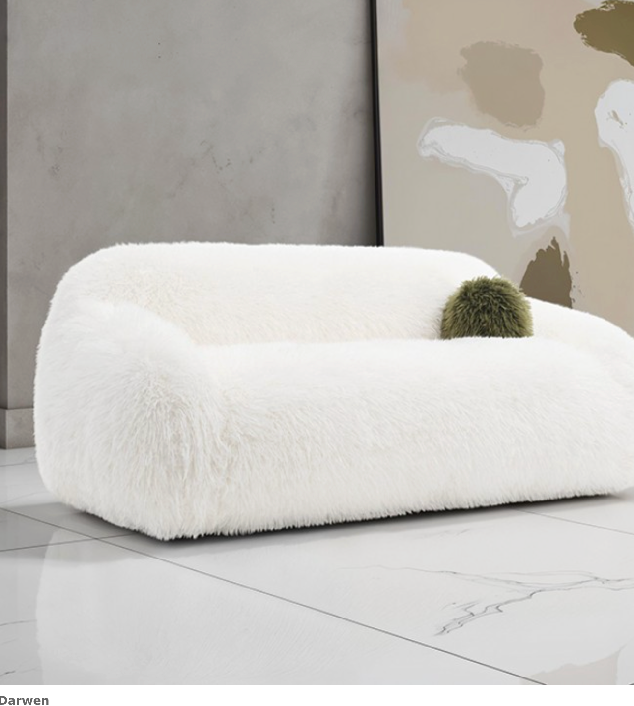 White fluffy ottoman with a green ball on a marble floor in a modern room.
