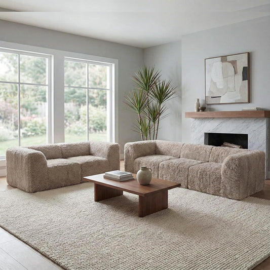 Modern living room with beige sofa, wooden coffee table, and fireplace.