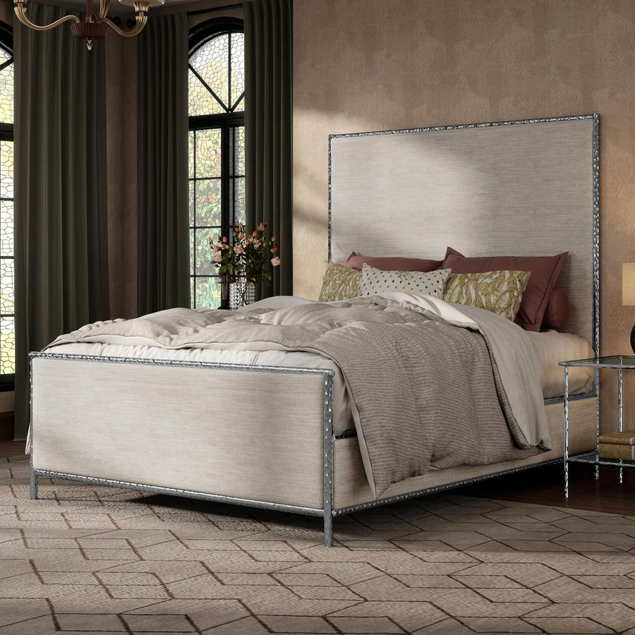 Neatly made bed with decorative pillows in a stylish bedroom setting.