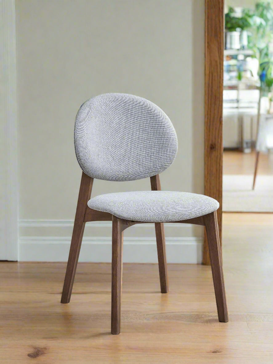 Chair with gray cushioned backrest and seat on a white background