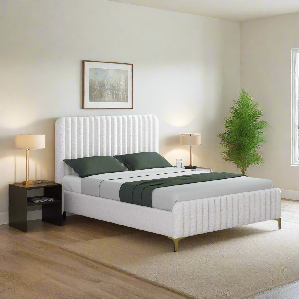 Modern bedroom with a white bed, nightstands, and lamps.
