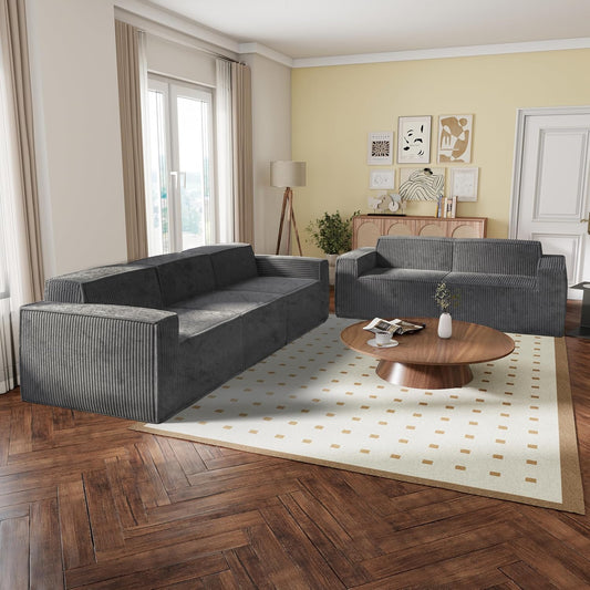Modern living room with gray sectional sofa, wooden coffee table, and decorative elements.