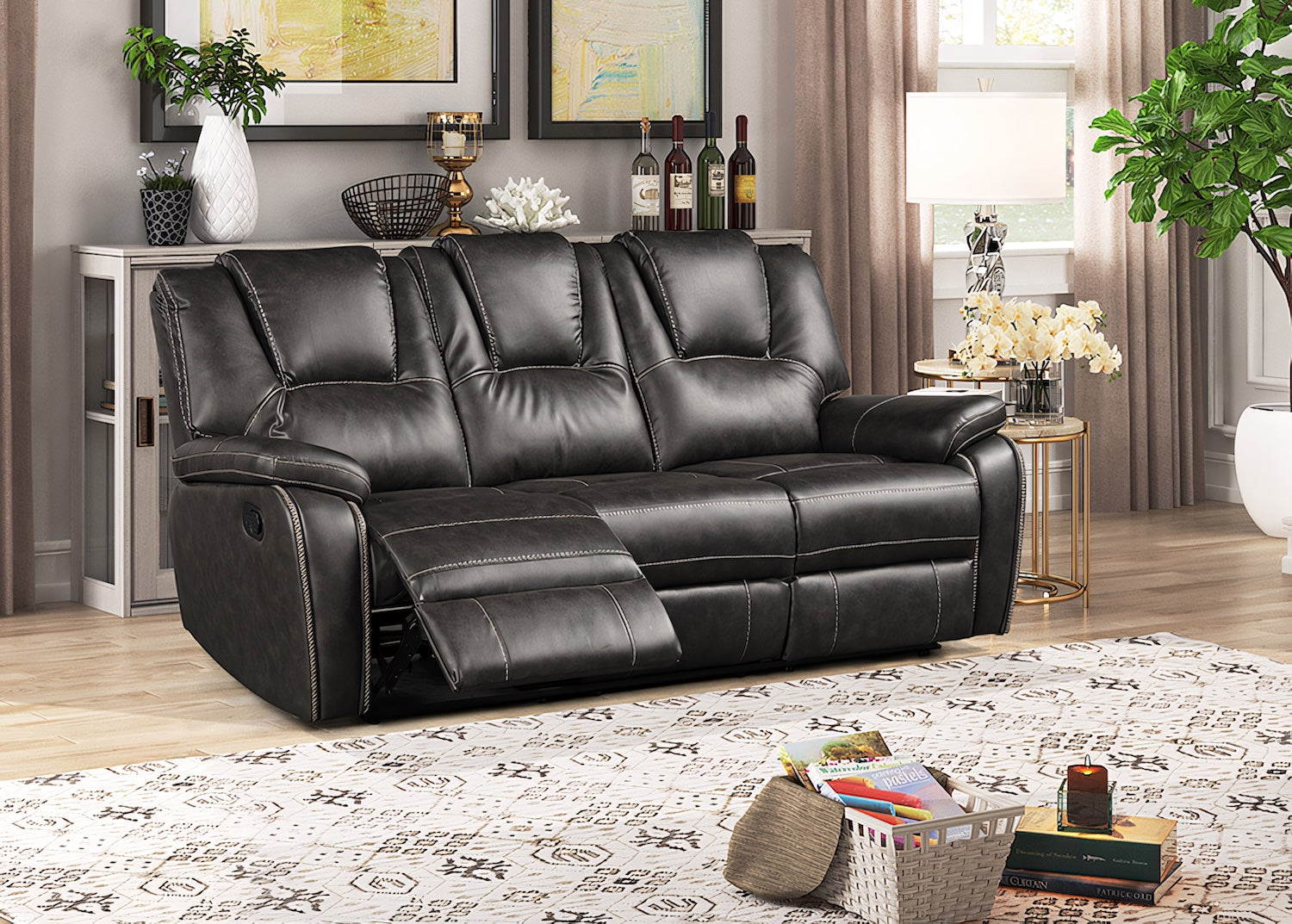 Black leather reclining sofa in a living room setting with decor elements.