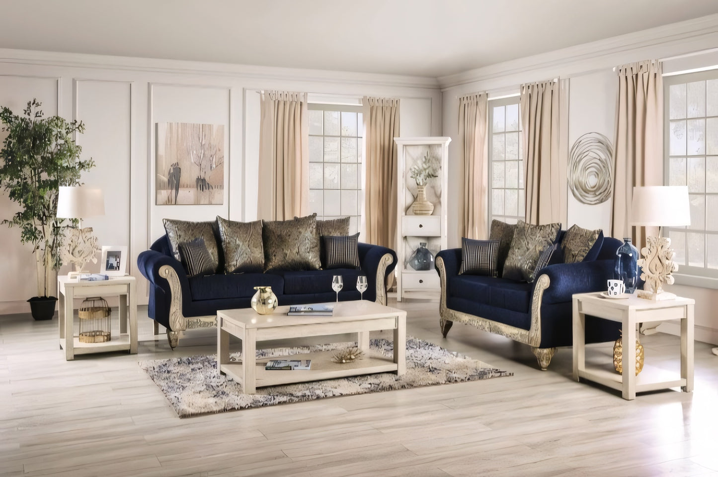 Living room with navy blue sofas, white coffee table, and decorative elements.