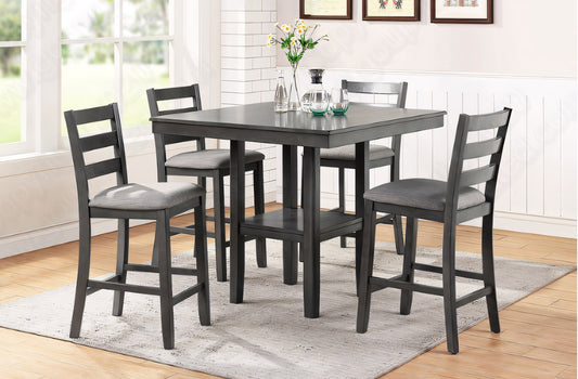 Gray dining table set with four matching chairs in a room with a window and framed pictures on the wall.