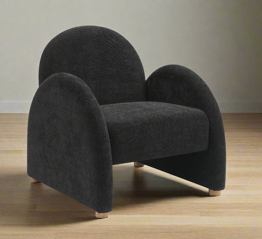 Black armchair with curved design on a white background