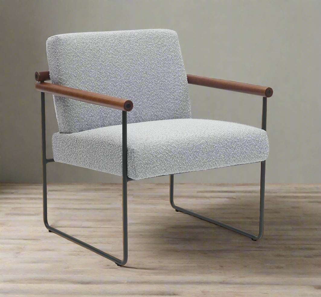 Gray upholstered chair with wooden armrests on a white background