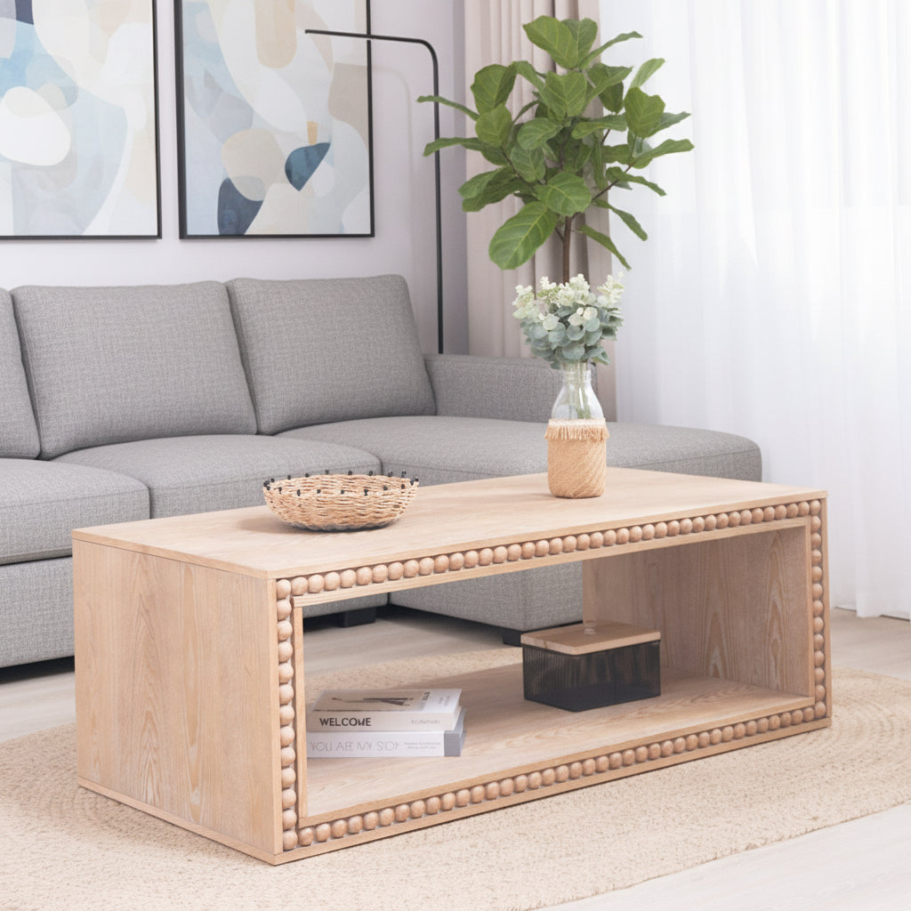 Wooden coffee table with decorative items in a living room setting