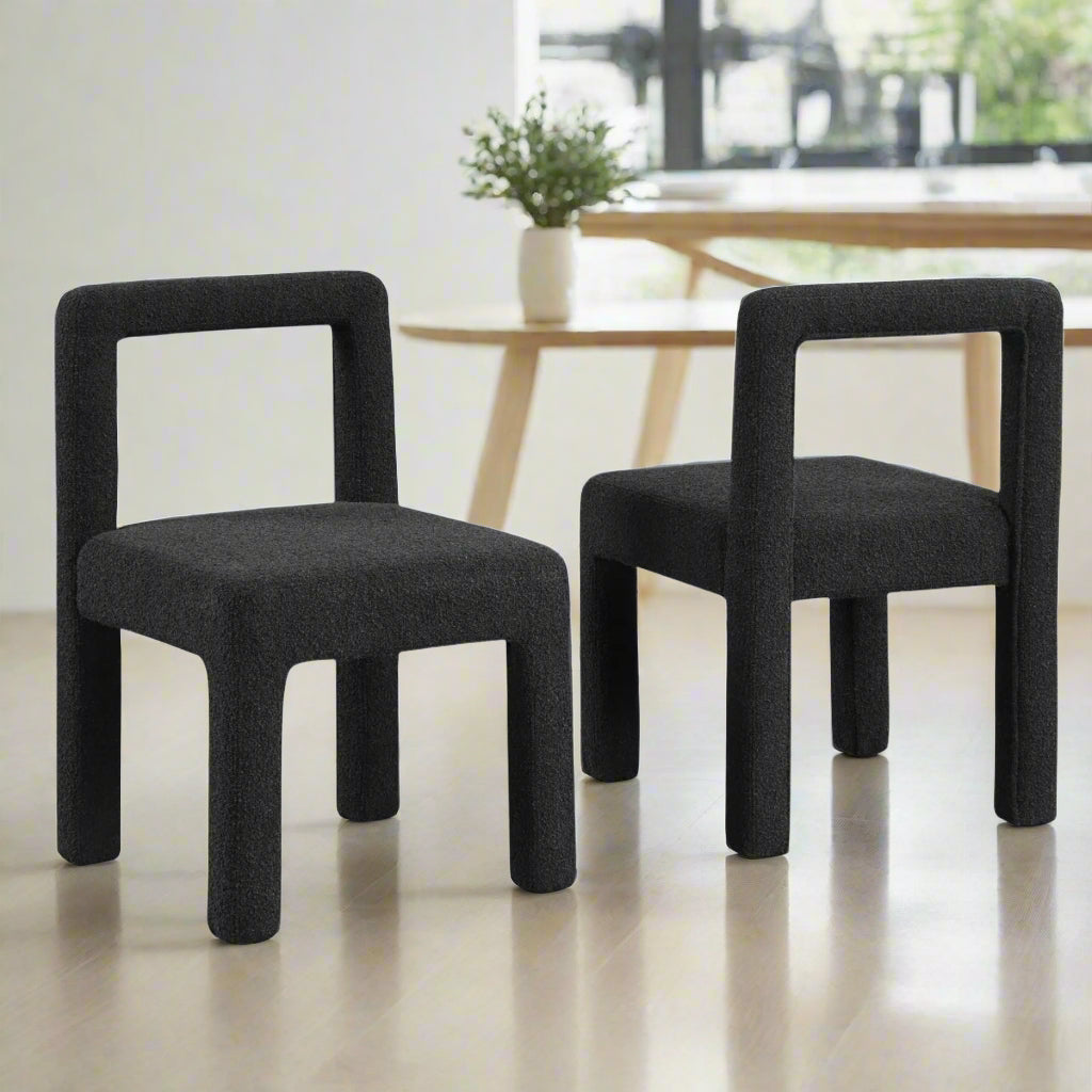 Two black chairs on a white background
