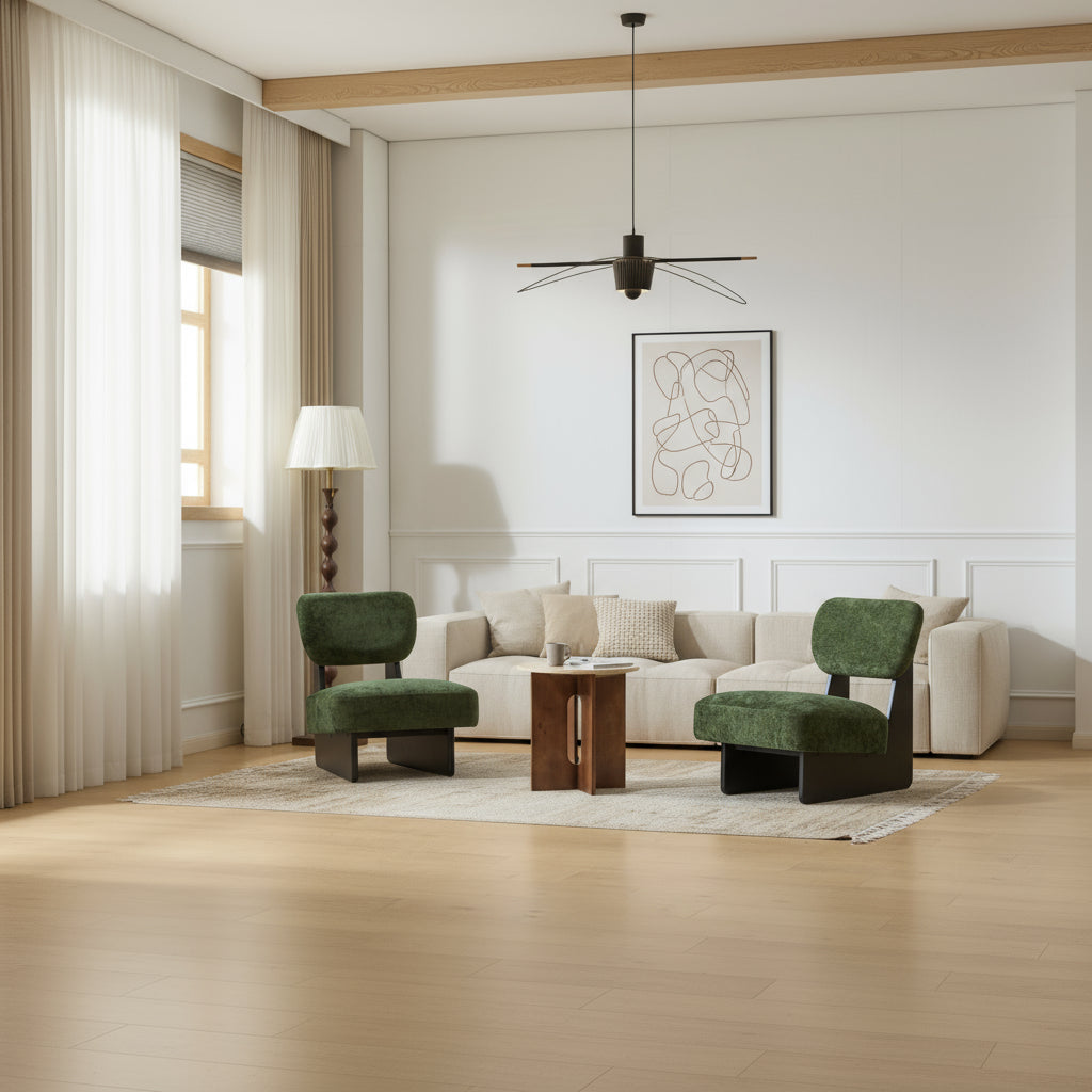 Two green chairs and a wooden table in a room with white walls and a lamp.