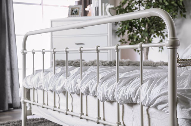 The Iria White Spindle Design Metal Bed